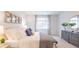Serene main bedroom featuring soft neutral tones, a large window, and comfortable furnishings at 812 Long Bluff Rd, Summerville, SC 29486