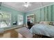Inviting bedroom with a ceiling fan, desk/vanity, and large windows offering bright natural light at 820 Old Cordesville Rd, Moncks Corner, SC 29461
