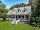 Inviting home with a classic facade, dormer windows and a welcoming front porch at 820 Old Cordesville Rd, Moncks Corner, SC 29461