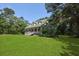 Classic home nestled among mature trees, offering a serene and private setting at 820 Old Cordesville Rd, Moncks Corner, SC 29461