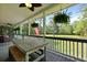 Spacious porch featuring ceiling fans, wicker furniture and a table with bench seating at 820 Old Cordesville Rd, Moncks Corner, SC 29461