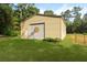 Exterior view of a detached garage with a roll-up door on a sunny day at 820 Old Cordesville Rd, Moncks Corner, SC 29461
