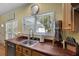 Bright kitchen with butcher block countertops and a window overlooking the backyard at 820 Old Cordesville Rd, Moncks Corner, SC 29461