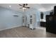 Stylish living room featuring modern cabinets, laminate flooring, and a ceiling fan at 820 Old Cordesville Rd, Moncks Corner, SC 29461