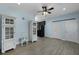 Stylish living room featuring modern cabinets, laminate flooring, and a ceiling fan at 820 Old Cordesville Rd, Moncks Corner, SC 29461