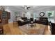 Comfortable living room with leather furniture, hardwood floors, and natural light at 820 Old Cordesville Rd, Moncks Corner, SC 29461