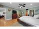 Relaxing bedroom featuring hardwood floors, a ceiling fan, and a classic dresser at 820 Old Cordesville Rd, Moncks Corner, SC 29461