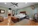 Spacious bedroom with hardwood floors, walk-in closet, and access to an ensuite bathroom at 820 Old Cordesville Rd, Moncks Corner, SC 29461