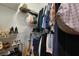 Organized walk-in closet with shelves and hanging rods for ample storage, plus a guitar at 820 Old Cordesville Rd, Moncks Corner, SC 29461