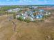 Aerial view of the community with marsh views and well-maintained landscaping that creates a serene environment at 840 Forrest Dr, Charleston, SC 29492