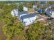 Aerial view showing the home's location in a well-landscaped neighborhood, nestled among mature trees, and picturesque streets at 840 Forrest Dr, Charleston, SC 29492