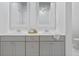Elegant bathroom with double vanity, framed mirrors, and neutral color palette creates a serene atmosphere at 840 Forrest Dr, Charleston, SC 29492
