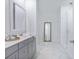 Elegant bathroom featuring double vanity, large mirror, and glass-enclosed shower at 840 Forrest Dr, Charleston, SC 29492