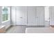 Bright bedroom with hardwood floors, natural light, and neutral color scheme creates a calming retreat at 840 Forrest Dr, Charleston, SC 29492