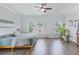 Comfortable bedroom with hardwood floors, ceiling fan, and plenty of natural light at 840 Forrest Dr, Charleston, SC 29492