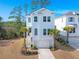 Charming two-story home with light blue siding, white trim, and a one-car garage at 840 Forrest Dr, Charleston, SC 29492