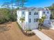 Charming two-story home with light blue siding, white trim, and a one-car garage at 840 Forrest Dr, Charleston, SC 29492