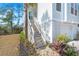 Entrance to this home featuring a staircase with beautiful flowers, leading up to the front door at 840 Forrest Dr, Charleston, SC 29492
