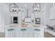 Spacious kitchen with island seating, stainless steel appliances, and modern light fixtures at 840 Forrest Dr, Charleston, SC 29492