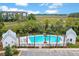 Community pool with palm trees, lounge chairs and marsh views, perfect for relaxation and socializing at 840 Forrest Dr, Charleston, SC 29492