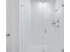 Bright, white tiled shower with glass door and chrome fixtures creates a clean and modern aesthetic at 840 Forrest Dr, Charleston, SC 29492