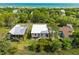 Charming coastal homes nestled among mature trees, offering serene views and privacy at 1012 E Erie Ave, Folly Beach, SC 29439