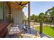 Relaxing balcony with stylish seating, modern ceiling fan, wood ceiling, and neighborhood views at 1012 E Erie Ave, Folly Beach, SC 29439