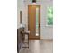 Stylish entryway featuring a wood door with glass, modern console table, and light-filled interior at 1012 E Erie Ave, Folly Beach, SC 29439