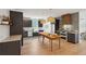 Spacious kitchen with an island, modern appliances, wood accents, and stylish light fixtures at 1012 E Erie Ave, Folly Beach, SC 29439