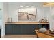 Bright kitchen offers dark cabinetry, wooden countertops, wine fridge, and natural light at 1012 E Erie Ave, Folly Beach, SC 29439