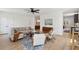 Open concept living room featuring neutral furniture, light wood floors, and stylish decor at 1012 E Erie Ave, Folly Beach, SC 29439