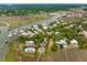 Breathtaking aerial view of the coastal community showcasing the waterfront homes and surrounding waterways at 104 Beach St, Mount Pleasant, SC 29464