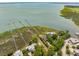 Aerial view of luxurious waterfront homes with private docks and expansive coastal marshland at 104 Beach St, Mount Pleasant, SC 29464