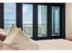This is a close-up view from the bedroom of a balcony that overlooks a peaceful waterway at 104 Beach St, Mount Pleasant, SC 29464