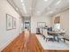 Bright dining room featuring hardwood floors, coffered ceilings, and stylish decor at 104 Beach St, Mount Pleasant, SC 29464