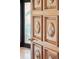 Ornate wooden door with decorative panels, enhancing the entryway's elegance at 104 Beach St, Mount Pleasant, SC 29464