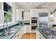 Modern kitchen with stainless steel appliances, custom cabinets, and granite countertops at 104 Beach St, Mount Pleasant, SC 29464