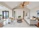 Bright living room with vaulted ceilings, built-ins, and comfortable seating at 104 Beach St, Mount Pleasant, SC 29464