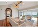 Cozy living room with vaulted ceiling, wood floors, and ocean views at 104 Beach St, Mount Pleasant, SC 29464