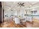Open concept living space with hardwood floors, coffered ceilings, and view of kitchen and living room at 104 Beach St, Mount Pleasant, SC 29464