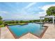 Beautiful pool and patio area with a pergola, offering stunning waterfront views and luxurious relaxation at 104 Beach St, Mount Pleasant, SC 29464