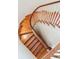 Curved wooden staircase featuring white spindles, providing a classic and elegant design detail at 104 Beach St, Mount Pleasant, SC 29464