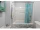 Bright bathroom featuring a tub with shower, blue-patterned curtain, and neutral walls at 106 Brown Ct, Summerville, SC 29486