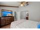 Cozy bedroom featuring a ceiling fan, wood beams, and TV atop a wooden dresser at 106 Brown Ct, Summerville, SC 29486
