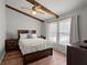 Comfortable bedroom with wood beams, ceiling fan, and abundant natural light at 106 Brown Ct, Summerville, SC 29486