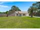 Inviting single-story home with a lush green lawn and mature trees providing shade at 106 Brown Ct, Summerville, SC 29486