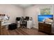 Well-lit office space with multiple monitors, desk, and a flatscreen TV at 106 Brown Ct, Summerville, SC 29486