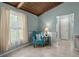 Cozy sitting area with natural light, blue chair, neutral accents and tile floors at 106 Brown Ct, Summerville, SC 29486