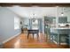 Well-lit dining room with wood floors, a modern light fixture, and easy access to the kitchen area at 1115 O T Wallace Blvd, Moncks Corner, SC 29461