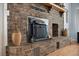 Close-up of a charming brick fireplace featuring a wooden mantel and decorative accents at 1115 O T Wallace Blvd, Moncks Corner, SC 29461